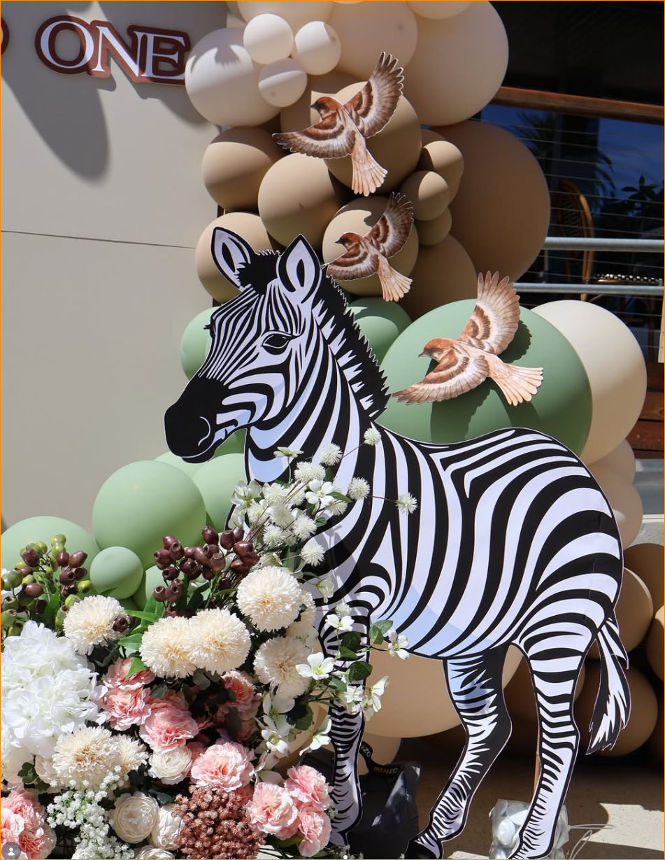 Zebra cut-out with soft green and neutral balloon styling